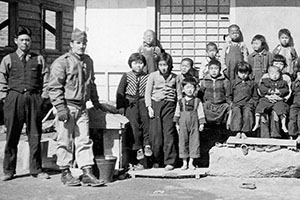 SFC James C. ‘Joe’ Pagnella and SMG interpreter Chon Do-hyun, ‘John Chun,’ deliver food and clothes to a nearby orphanage.