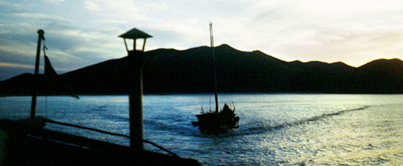 Towing a sailing junk. Often one motorized junk would tow three sailing junks on an operation.