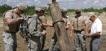 Retired SGM Tabata on a Fort Bragg range c. 2005 checking an SF Engineer Course students demolition charge.