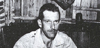 LTC Volckmann with a sword captured from a Japanese general. It reflects the damage inflicted on the enemy by his five guerrilla regiments.