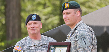 Then-Sgt. 1st Class Earl D. Plumlee, assigned to 1st Special Forces Group (Airborne), is presented the Silver Star Medal by Maj. Gen. Kenneth R. Dahl, I Corps Deputy Commanding General, during a cere-mony at the 1st SFG (A), Joint Base Lewis-McChord, Wash.