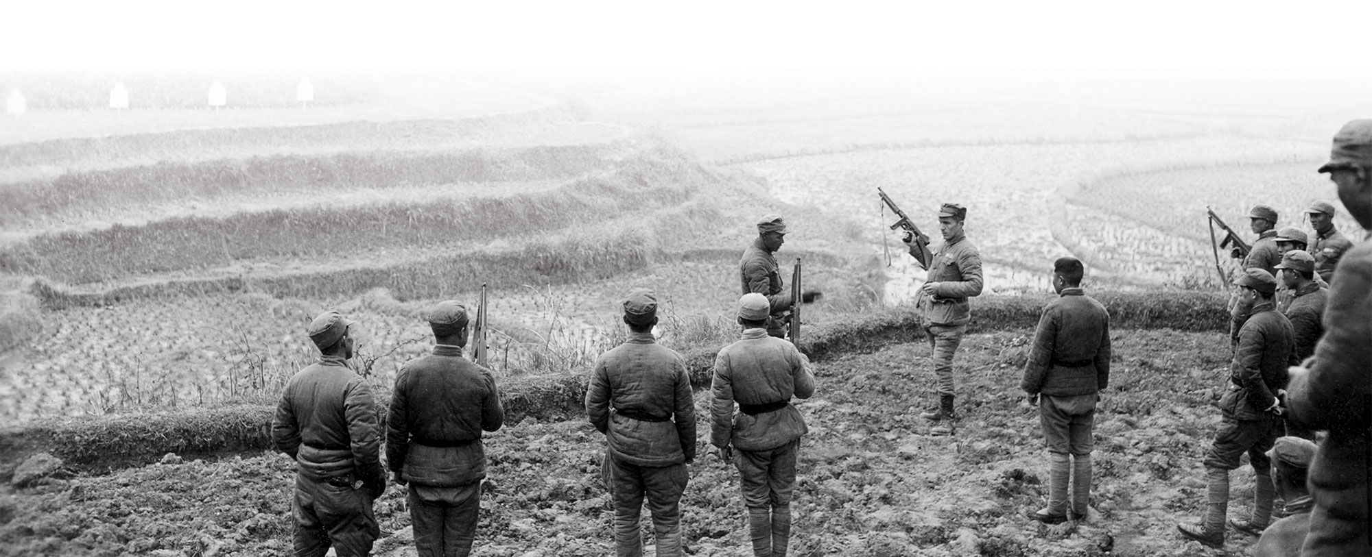 CPT Walter R. Mansfield of Team MUSKRAT instructs Chinese troops on the use of the Thompson sub-machinegun, China 1945.