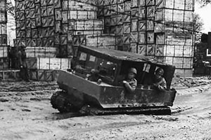 Troops in M29 Weasel at ordnance depot in France